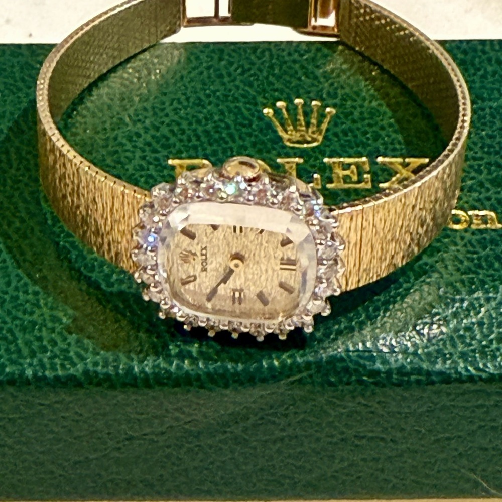 Authentic Rolex Women's Gold Watch with diamond cocktail Bezel.14k solid gold.